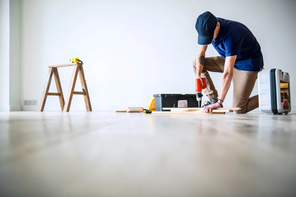 top-view-man-tiling-floor_23-214